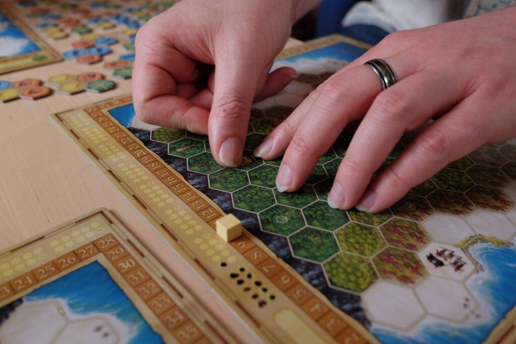 A tasteful shot of a player applying a sticker to their board.