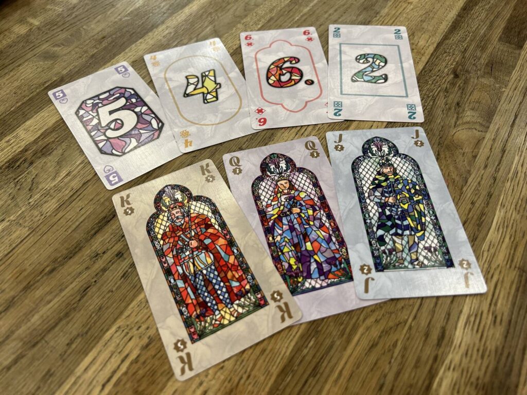 The cards are oversized and, particularly in the case of the three wilds, very pretty.