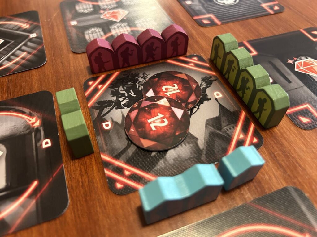 The card in the photo has red pieces to the north, blue pieces to the south, and green pieces to the east and west. There are 24 gems in the room.