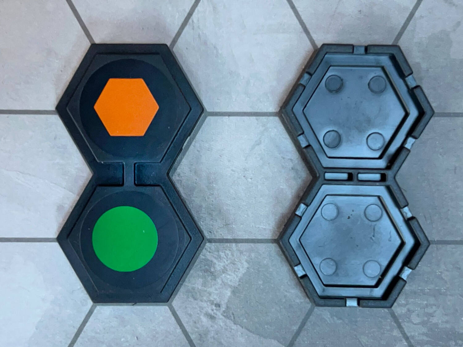 The perpendicular line on the top of the tile lines up with the bracing line between the hexes on the underside. This prevents any one piece from being put on top of any other single piece.