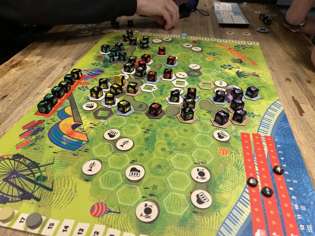 The board shows an open field, covered in stages and hexagons. Many of the spaces, though nowhere near all, are covered with dice.