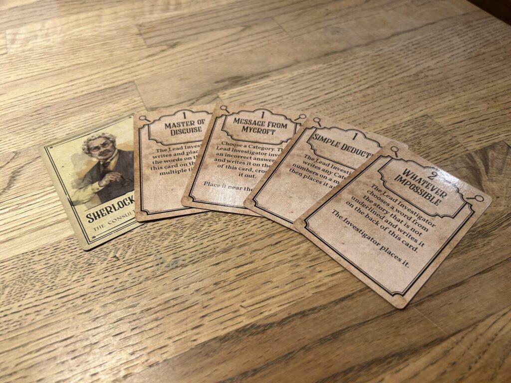 The Sherlock Holmes character card, fanned out with four of his investigation cards.