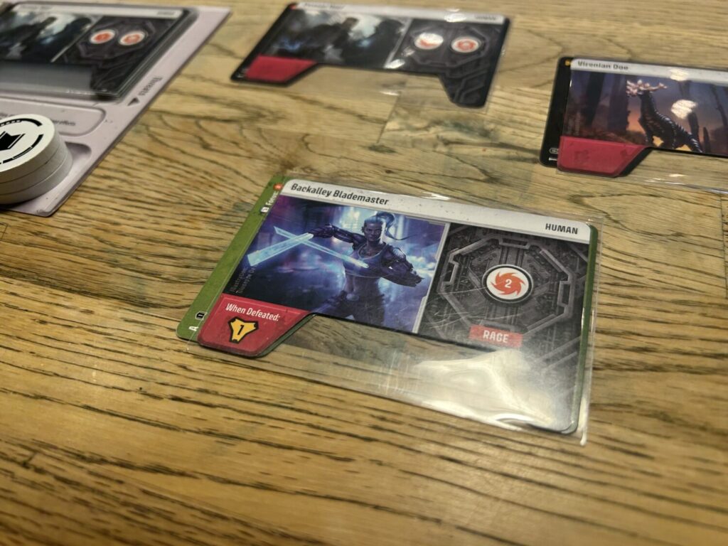 A close-up picture of a Threat card, which shows its attack value on the right side and features an illustration on the left.