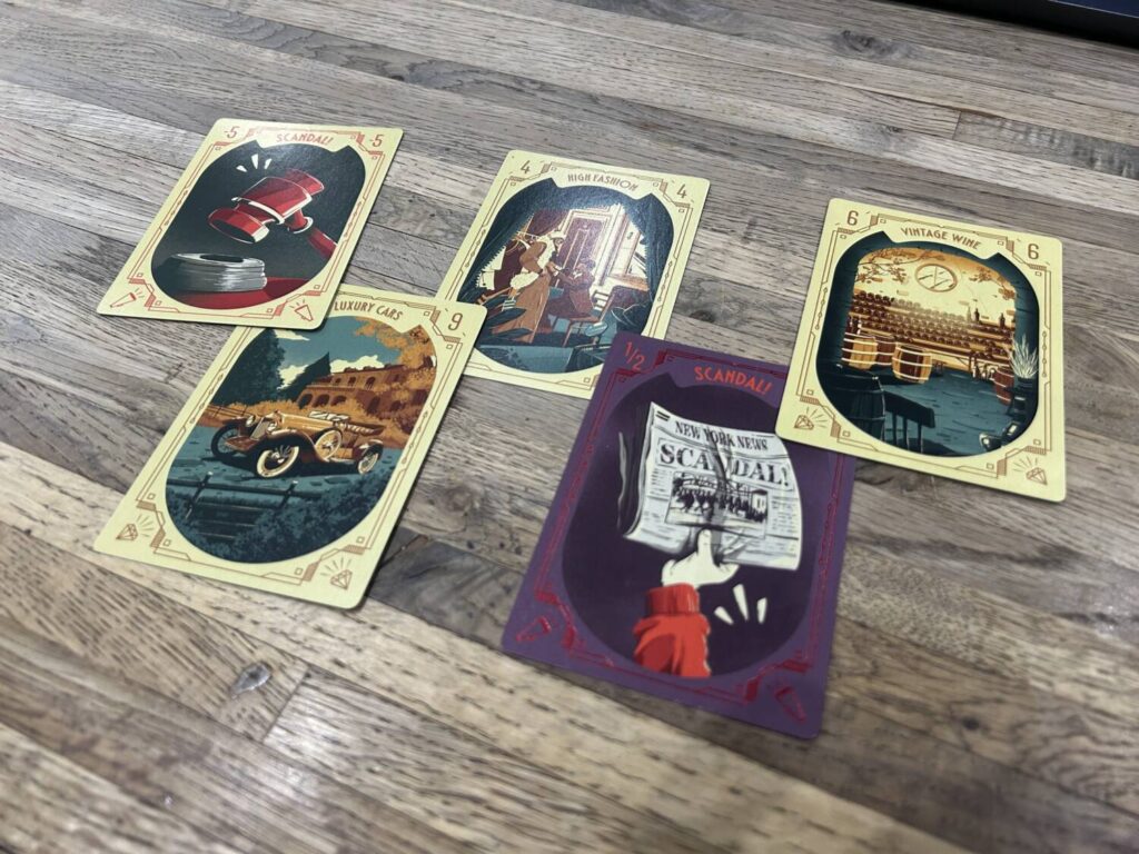 A selection of scoring cards, laid out on a wooden table.