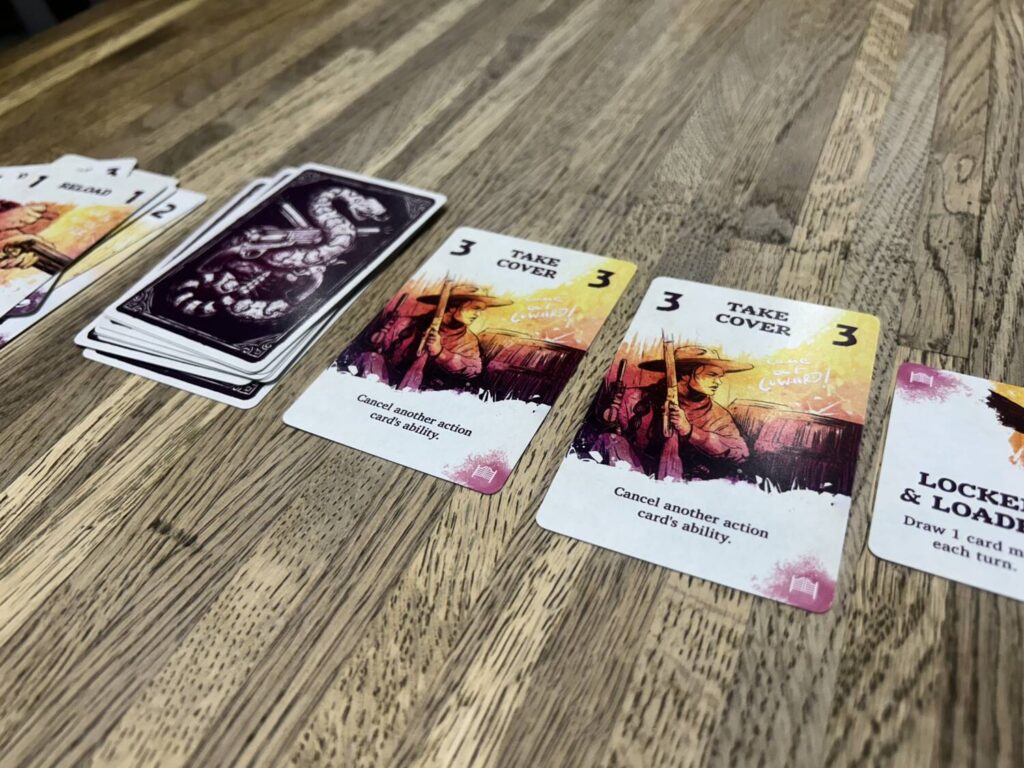 A photo of the market row, several cards in a line next to a deck.