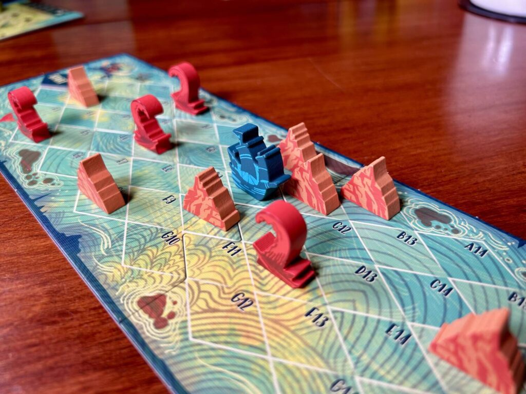 The ship is attempting to navigate a tight channel between two islands blocking its path.