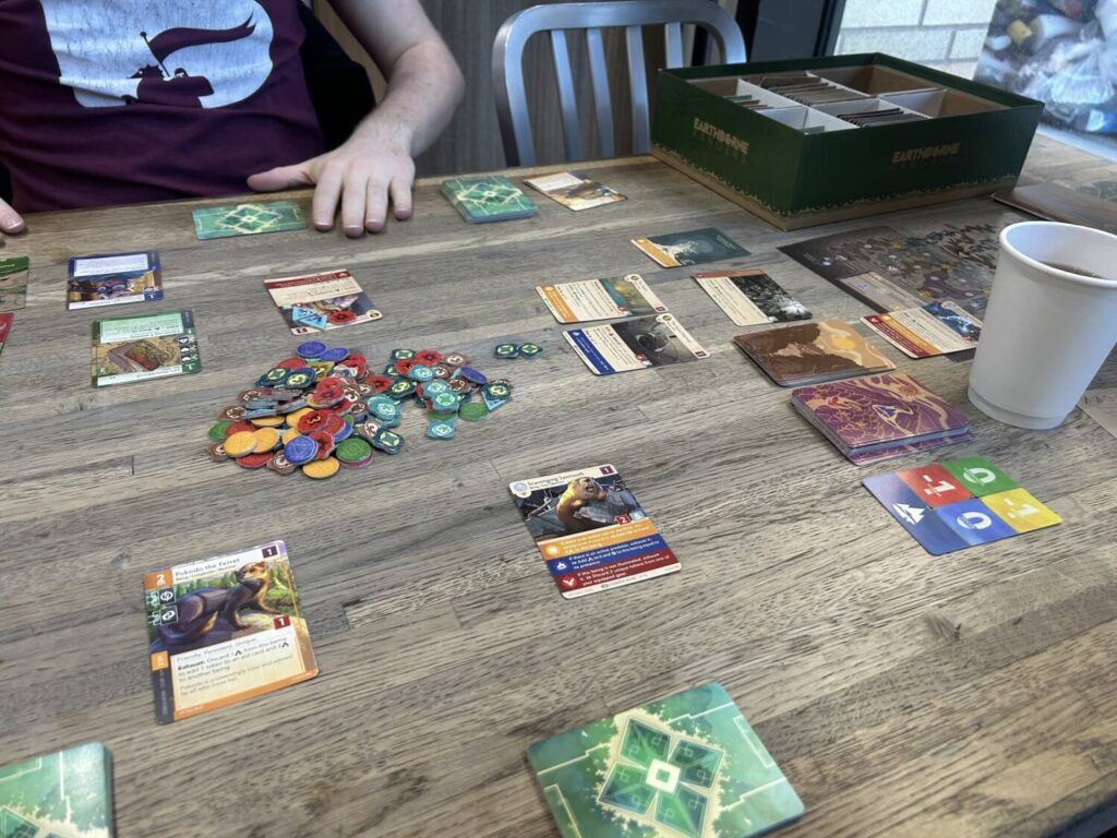 A table full of cards, cards in all directions.