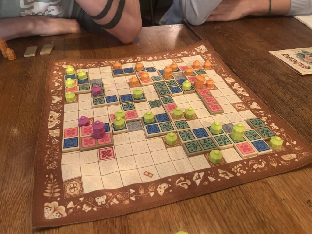 Another similar photo, this time on a tan board with different special spaces.