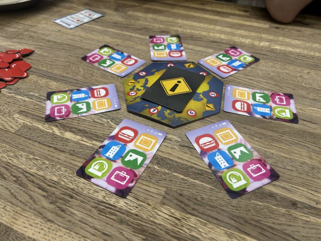 The central board, a heptagon surrounded by seven face-down cards.