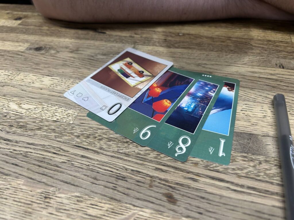 A set of four cards laid out to create the number 1,890.